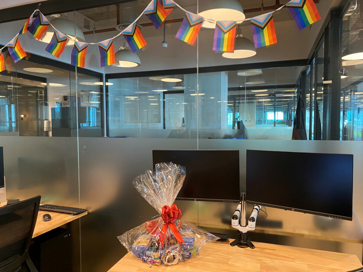 Pride Launch Hamper full of goodies to celebrate Pride, sat on an office desk